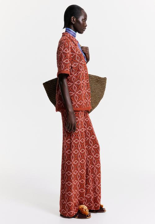 H&M - THE WHITE LOTUS H&M - Crocheted trousers - orange patterned 