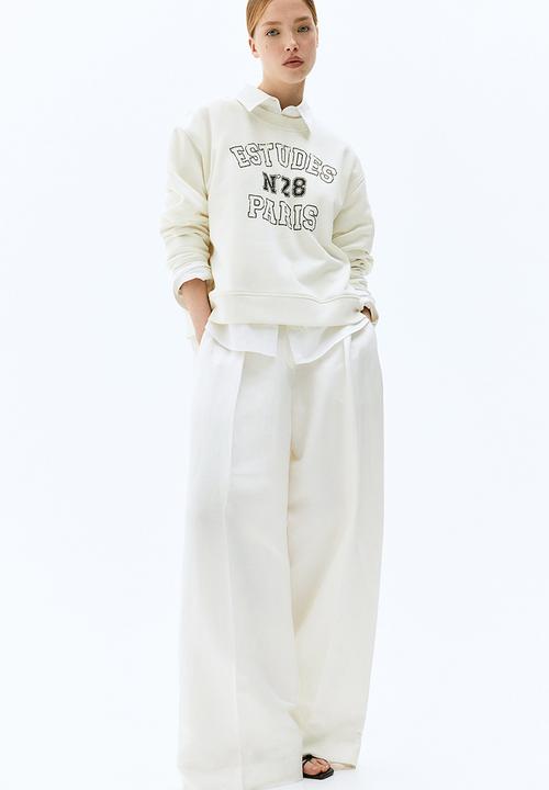 H&M - Oversized motif-front sweatshirt - cream & paris