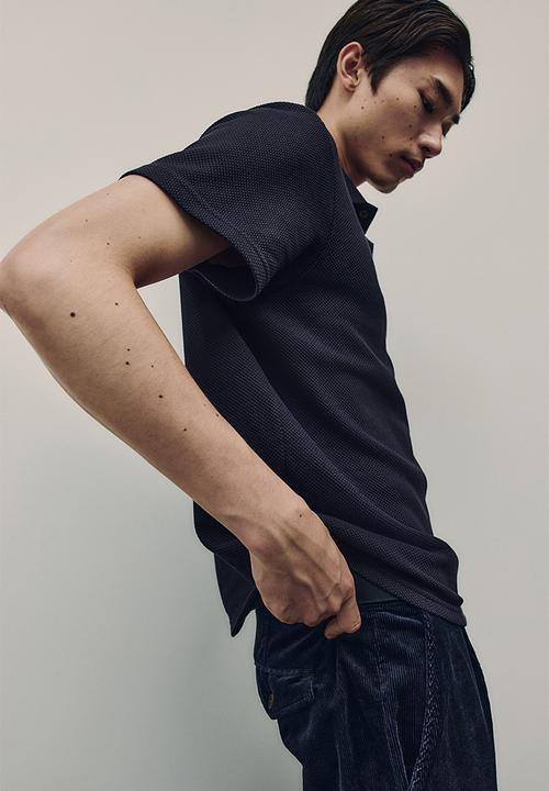 H&M - Regular fit textured-knit polo shirt - navy blue 