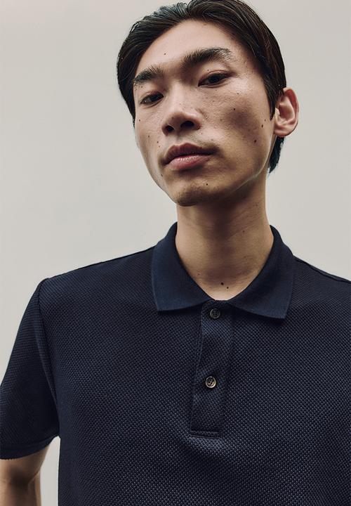 H&M - Regular fit textured-knit polo shirt - navy blue 