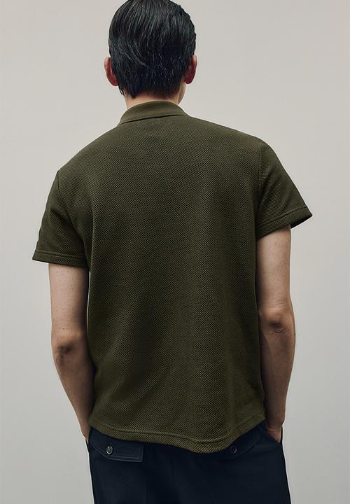 H&M - Regular fit textured-knit polo shirt - dark green 