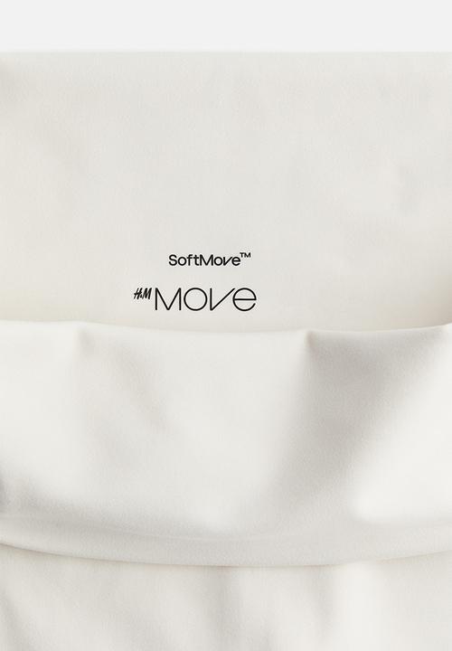 H&M - Flared yoga leggings in softmove™ - white