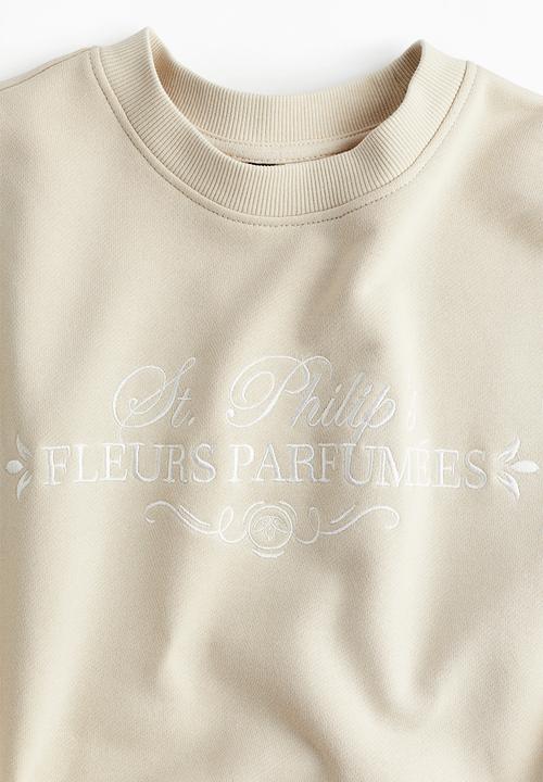 H&M - Oversized motif-detail sweatshirt - light beige/fleurs parfumées