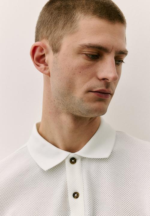 H&M - Regular fit piqué polo shirt - cream