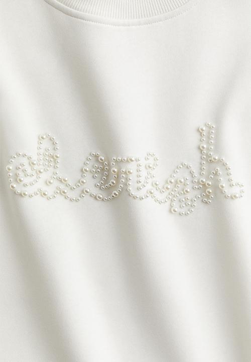H&M - Oversized embellished sweatshirt - cream cherish