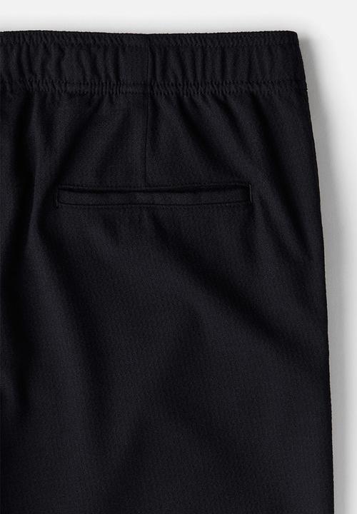 H&M - Relaxed fit twill trousers - navy blue 