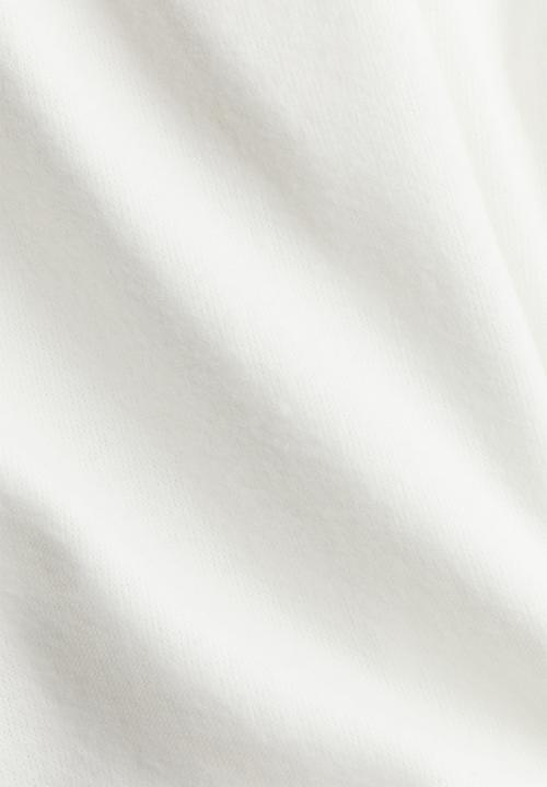 H&M - Flared fine-knit leggings - cream