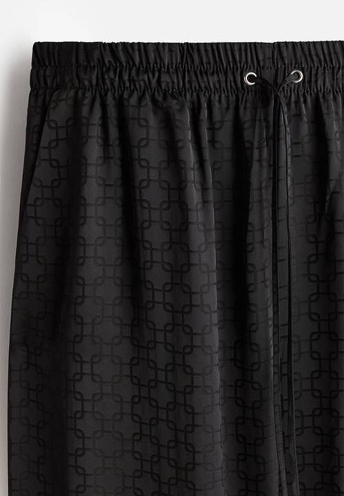 H&M - Wide drawstring trousers - black patterned 