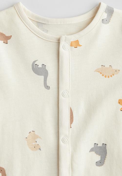 H&M - Patterned sleepsuit - cream dinosaurs
