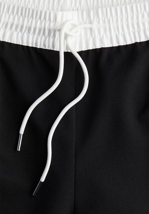 H&M - Crease-leg drawstring trousers - black & white