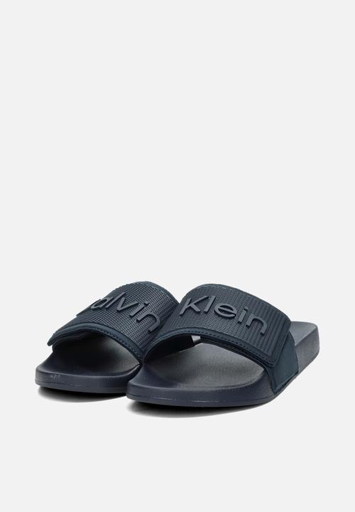 Calvin Klein - ADJ POOL SLIDE TPU - Calvin Navy