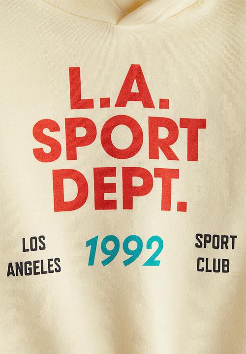 H&M - Printed hoodie - light yellow l.a. sport dept