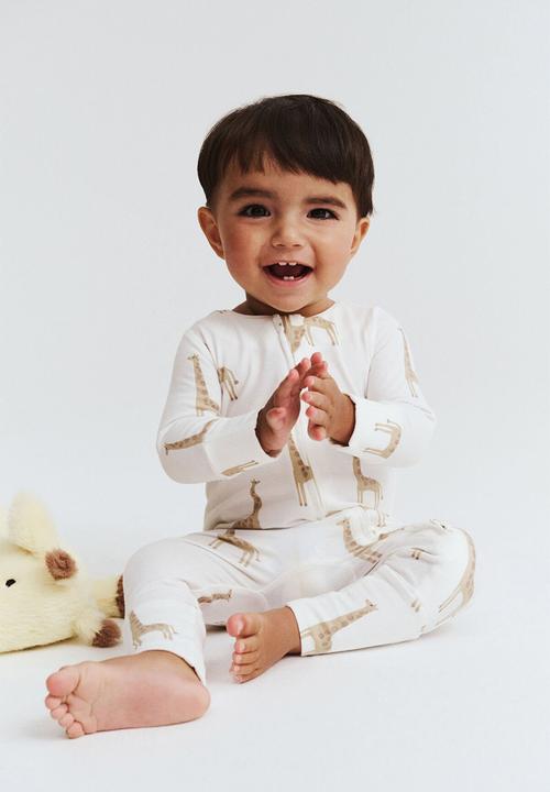 Cotton On - The long sleeve zip romper - vanilla/gerry giraffe
