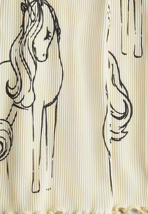 H&M - Flared leggings - light yellow unicorns