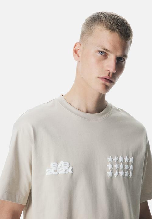 H&M - Loose fit printed t-shirt - beige stars