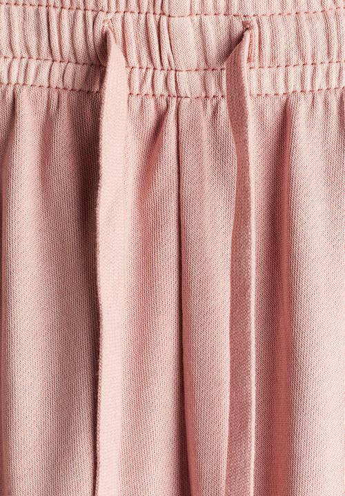 H&M - Washed cotton sweatpants - dusty pink 