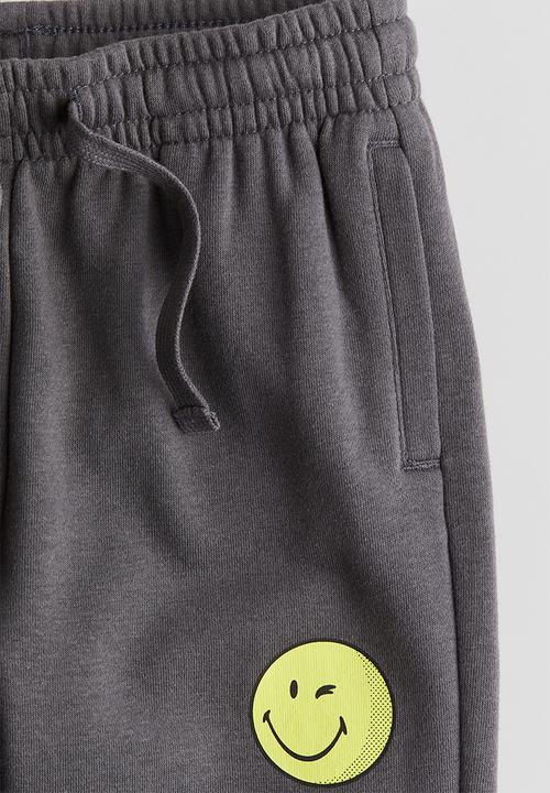 H&M - Motif-detail joggers - dark grey smileyworld®