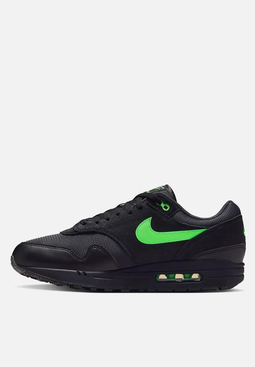 lime green black nike shoes