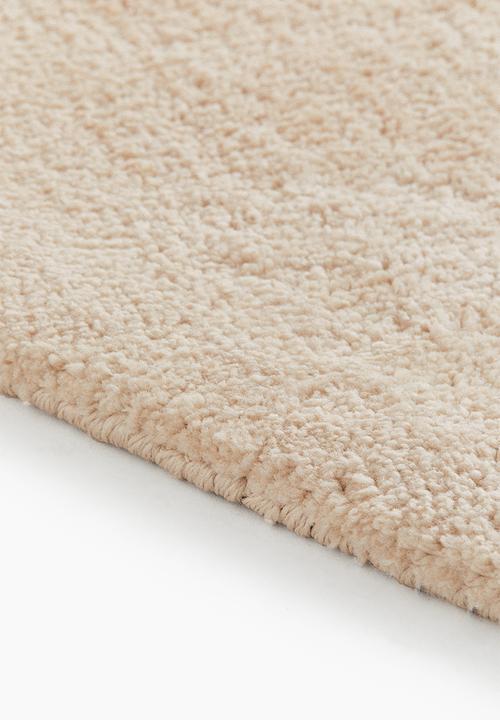 H&M - Large asymmetric rug - light beige