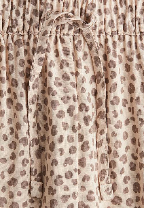 H&M - Woven joggers - light beige/leopard print