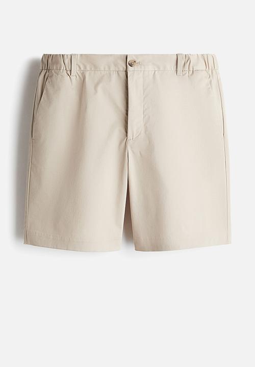 H&M - Regular fit chino shorts - light beige 