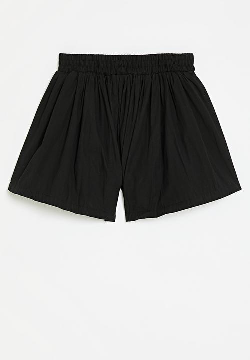 Pop Candy - Flared shorts - black