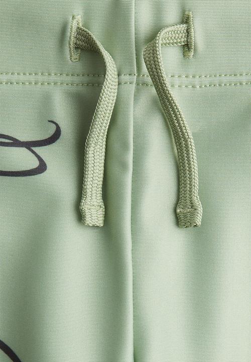 H&M - Printed swimming trunks - light green/spidey