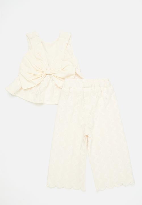 Pop Candy - Textured peplum top with bow feature & scallop hem pants - off white