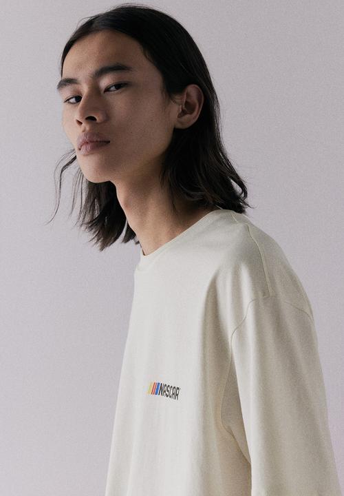 H&M - Loose fit t-shirt - cream nascar