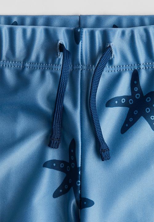 H&M - Printed swimming trunks - blue starfish