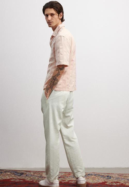 H&M - Relaxed fit lyocell-blend trousers - white