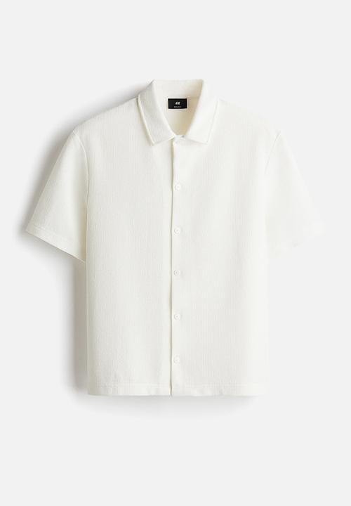 H&M - Regular fit short-sleeved jersey shirt - cream