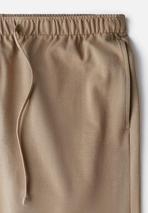 H&M - Relaxed fit knee-length piqué shorts - beige