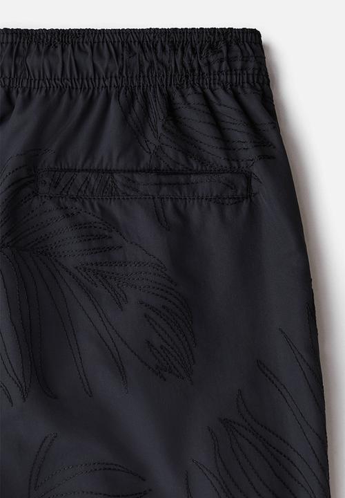 H&M - Patterned swim shorts - black leaf-patterned