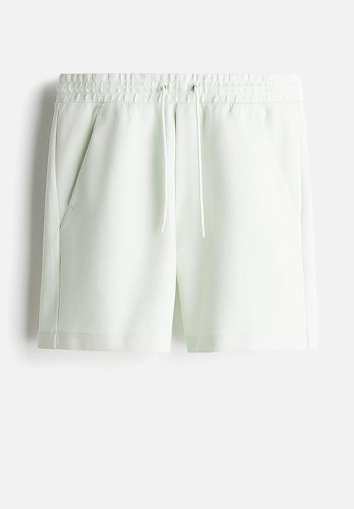 H&M - Regular fit sweatshorts - pale green 
