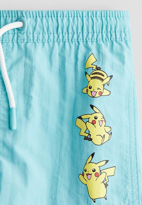 H&M - Printed swim shorts - turquoise/pokémon