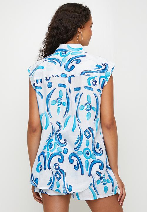 MANDI - Sleeveless Button Through Sheer Printed Blouse Longer Length - Blue