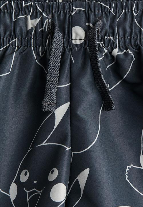 H&M - Printed swim shorts - dark grey/pokémon