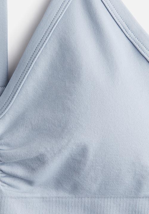 H&M - Seamless medium support sports bra with drymove™ - light blue
