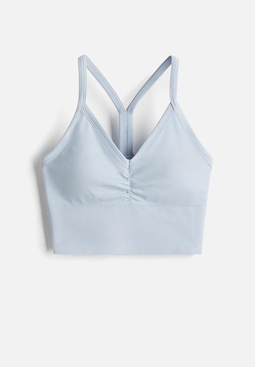 H&M - Seamless medium support sports bra with drymove™ - light blue