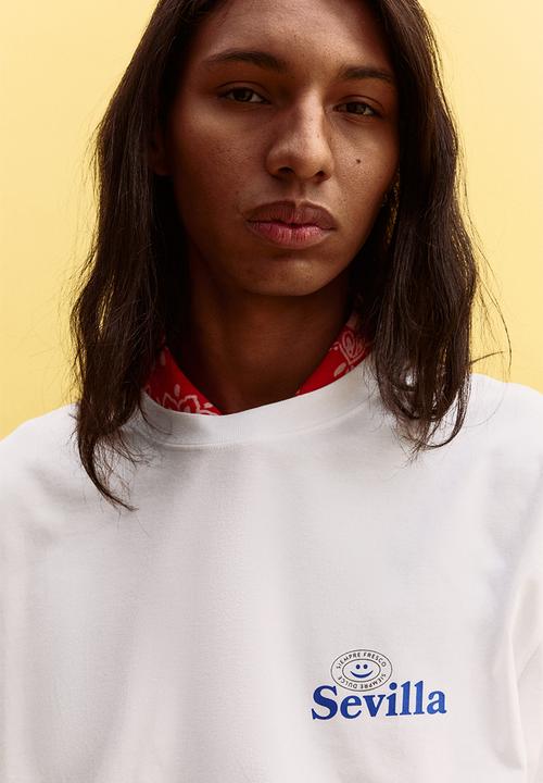 H&M - Loose fit printed T-shirt - white/sevilla