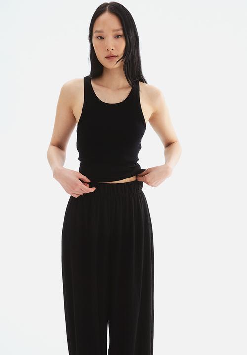 H&M - Wide trousers - black