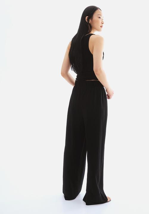H&M - Wide trousers - black
