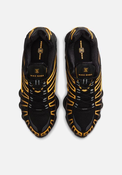 black and gold nike shox