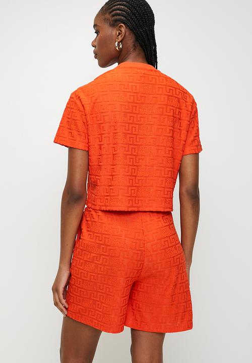 Steve Madden - Ladies bella embossed logo jogger shorts - tangerine