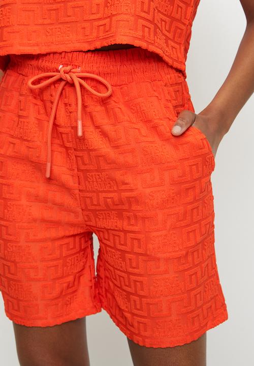 Steve Madden - Ladies bella embossed logo jogger shorts - tangerine