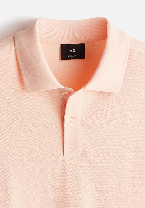 H&M - Regular fit piqué polo shirt - orange