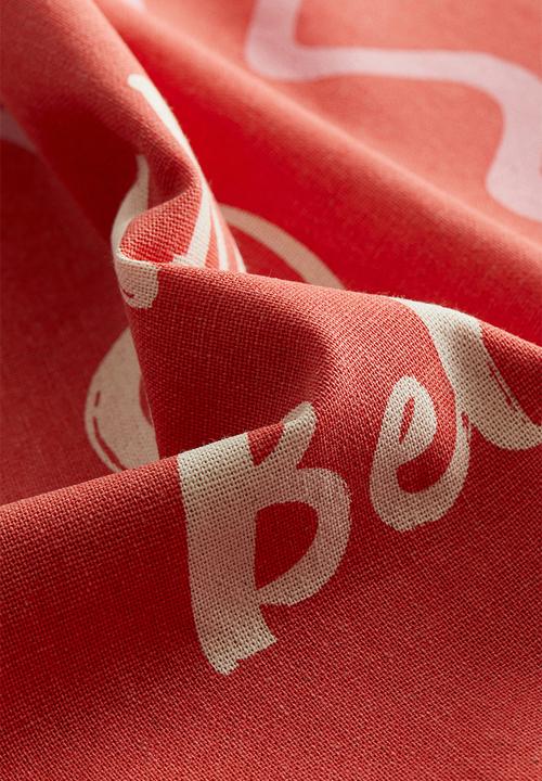 H&M - Printed cotton cushion cover - coral red/ciao bella