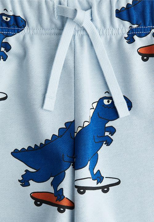 H&M - Printed sweatshorts - light blue/dinosaurs
