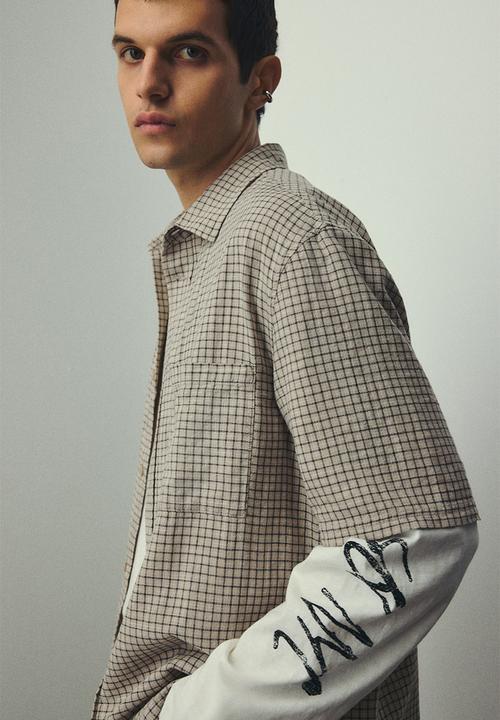 H&M - Oversized fit short-sleeved linen-blend shirt - beige checked